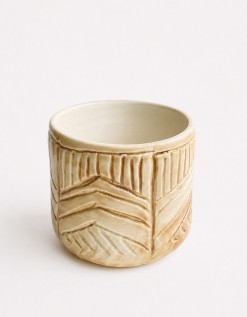 Handbuilt carved cylindrical form ceramic teacup