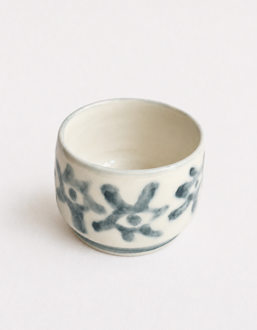 Handbuilt underglaze decorated teacup