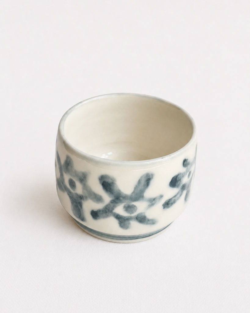 Handbuilt underglaze decorated teacup