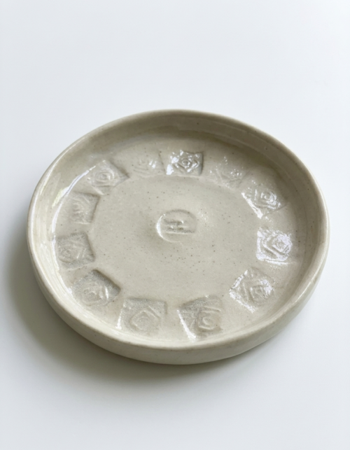 Stamped ceramic saucer, teaware form